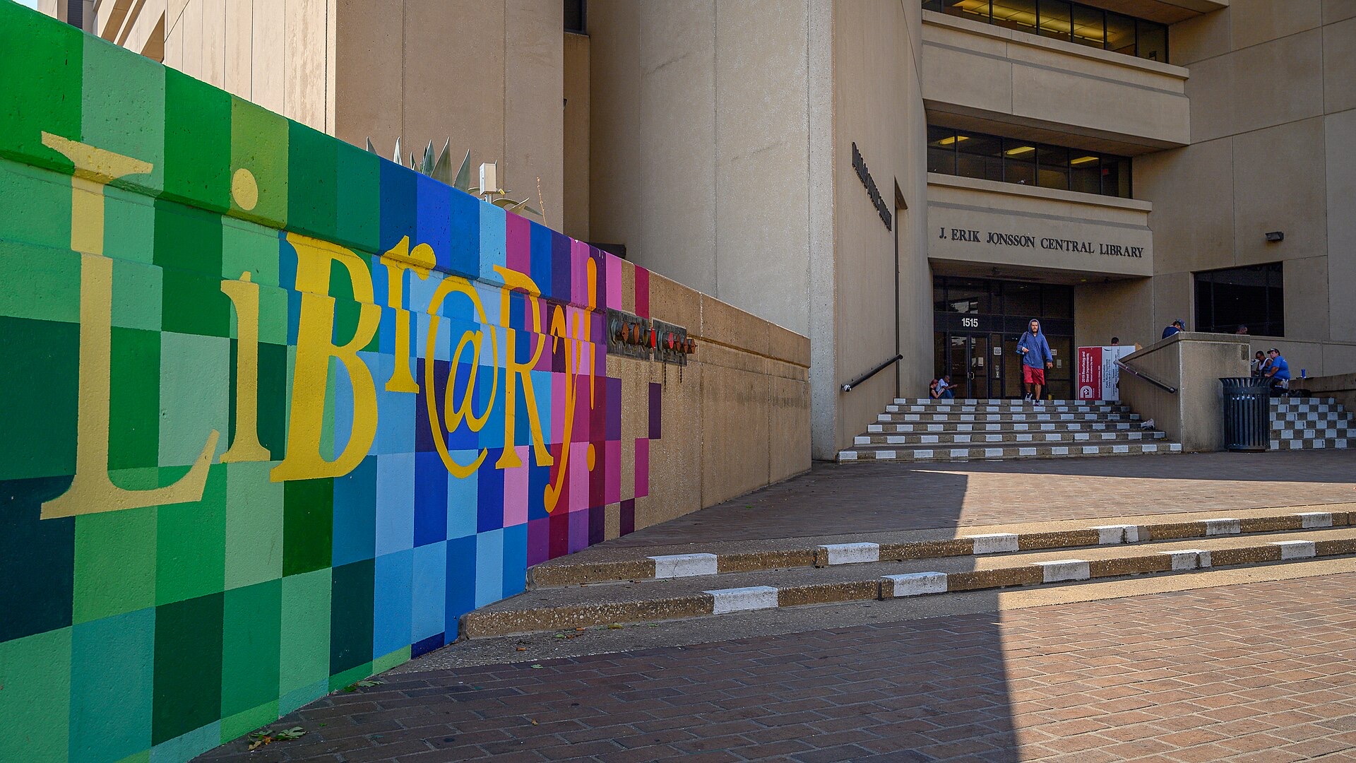 The J. Erik Jonsson Central Library entrance in downtown Dallas, with a colorful mural